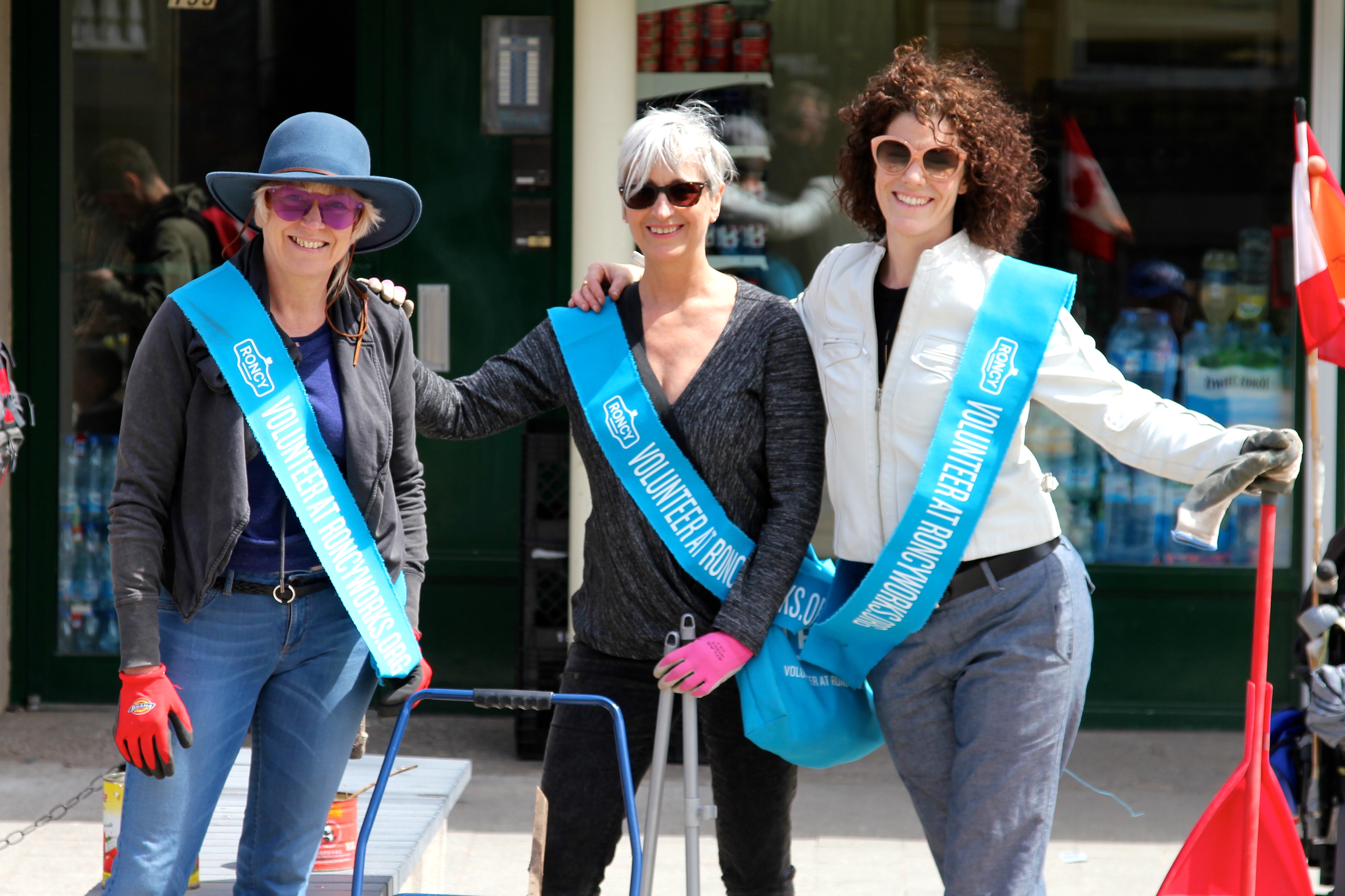 Three members of RoncyWorks enjoying a sunny break on Roncesvalles Avenue during the spring cleanup.